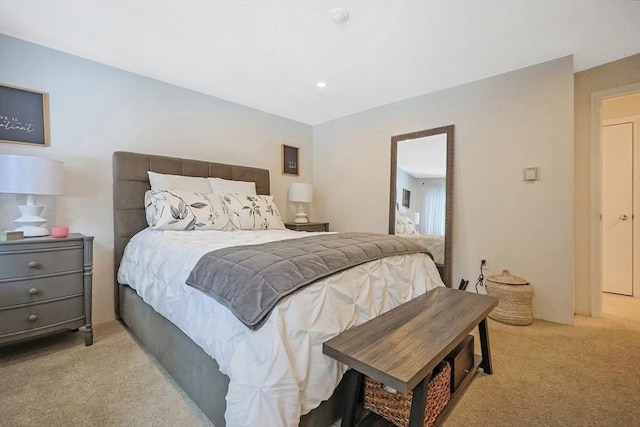 bedroom featuring light colored carpet