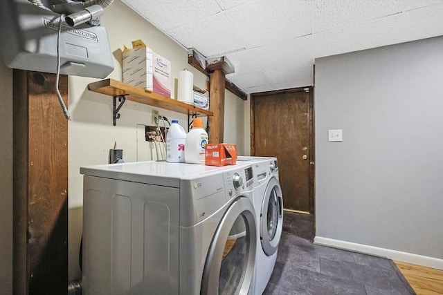 clothes washing area featuring washing machine and clothes dryer