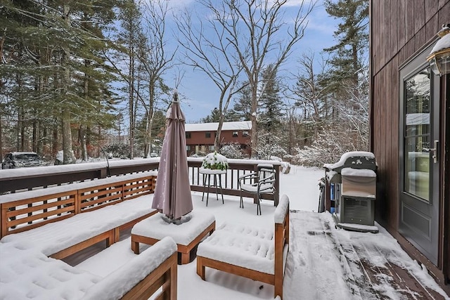 snow covered deck with area for grilling