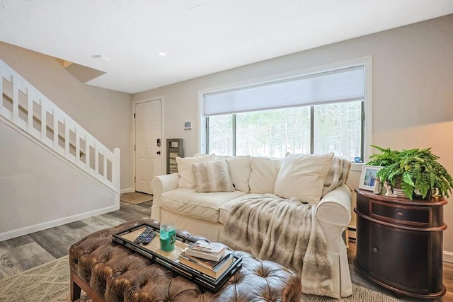 living room with hardwood / wood-style flooring and baseboard heating