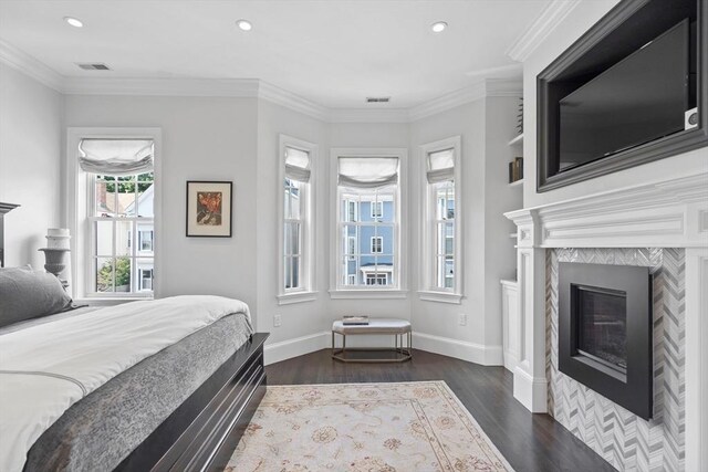 795 E 4th St, Boston, MA 02127 - bedroom featuring dark wood-type flooring, recessed lighting, baseboards, ornamental molding, and a tile fireplace