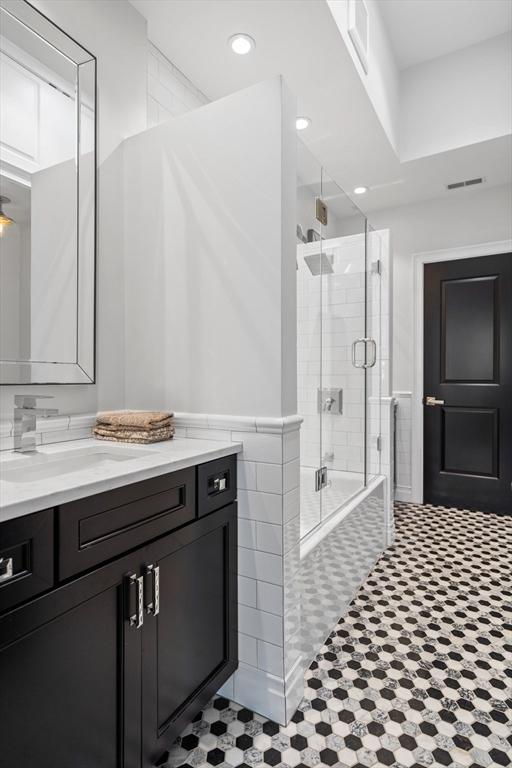 795 E 4th St, Boston, MA 02127 - full bath featuring vanity, tiled shower / bath, and recessed lighting