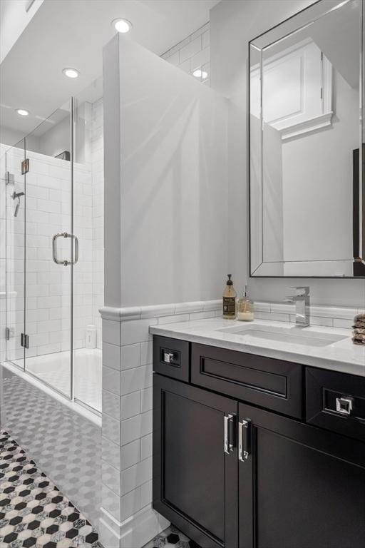 795 E 4th St, Boston, MA 02127 - bathroom featuring vanity, tiled shower / bath, and recessed lighting