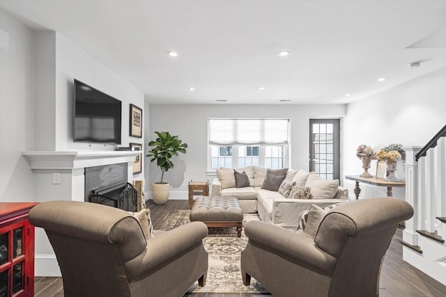 795 E 4th St, Boston, MA 02127 - living area with stairway, dark wood-type flooring, a fireplace, recessed lighting, and baseboards
