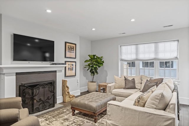 795 E 4th St, Boston, MA 02127 - living area featuring wood finished floors, baseboards, a fireplace, and recessed lighting