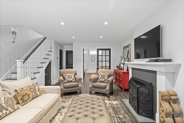 795 E 4th St, Boston, MA 02127 - living area featuring stairs, a fireplace with flush hearth, recessed lighting, baseboards, and wood finished floors
