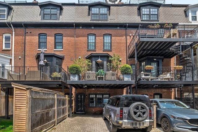 795 E 4th St, Boston, MA 02127 - back of property with mansard roof and brick siding