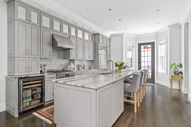795 E 4th St, Boston, MA 02127 - kitchen with range hood, wine cooler, a sink, dark wood-style floors, and gray cabinetry