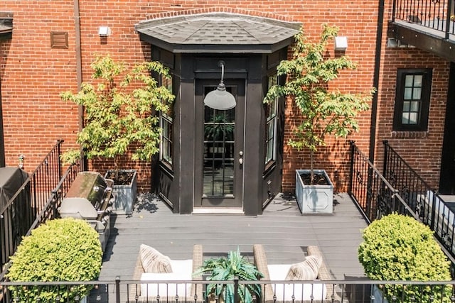 795 E 4th St, Boston, MA 02127 - doorway to property featuring brick siding and a deck