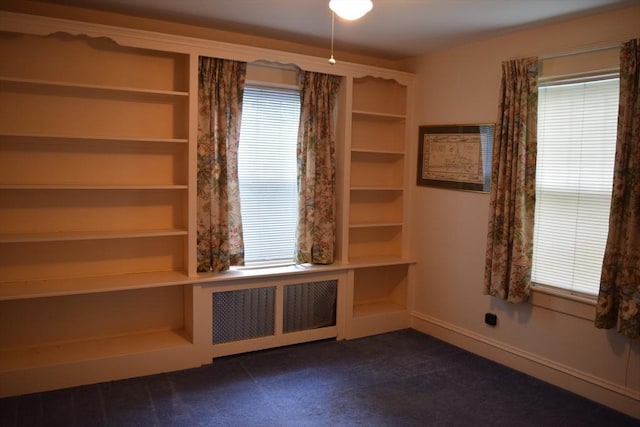 959 Ray St, Fall River, MA 02720 - empty room with dark colored carpet, healthy amount of natural light, and radiator heating unit