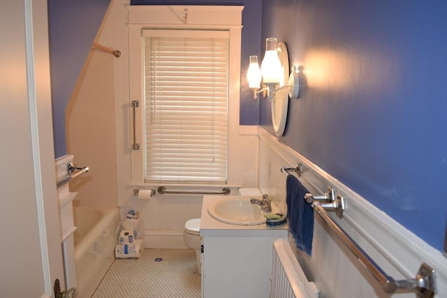 959 Ray St, Fall River, MA 02720 - full bath with radiator heating unit, vanity, a wainscoted wall, and a decorative wall
