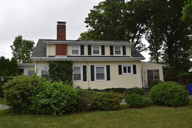 959 Ray St, Fall River, MA 02720 - view of front of house with a chimney and a front yard