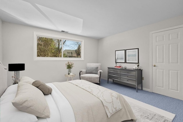 bedroom featuring visible vents, baseboards, and carpet floors