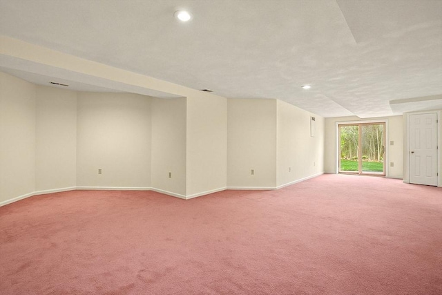unfurnished living room featuring light colored carpet, recessed lighting, and baseboards