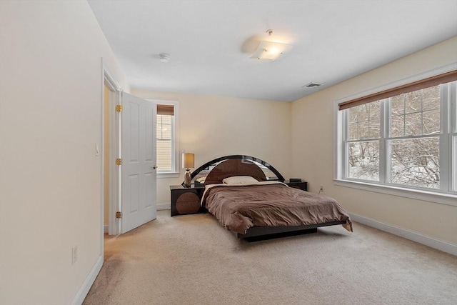 bedroom with light carpet