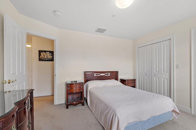 carpeted bedroom with a closet