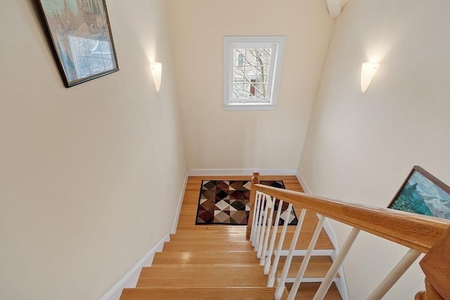 staircase featuring hardwood / wood-style flooring