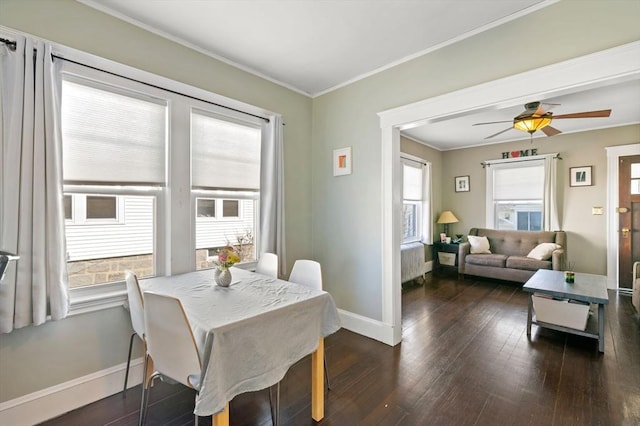 165 Harriet Ave, Quincy, MA 02171 - dining room with dark wood-style floors, ceiling fan, and crown molding
