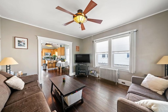 165 Harriet Ave, Quincy, MA 02171 - living area with radiator heating unit, a ceiling fan, dark wood-style floors, and ornamental molding