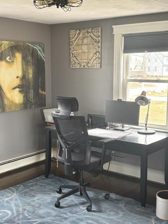 110 Atwell Cir, Marshfield, MA 02050 - home office with a baseboard heating unit, a chandelier, and wood finished floors