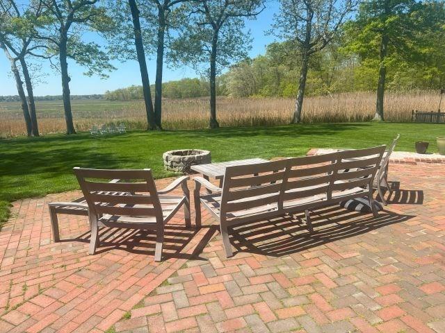 110 Atwell Cir, Marshfield, MA 02050 - view of patio featuring a fire pit