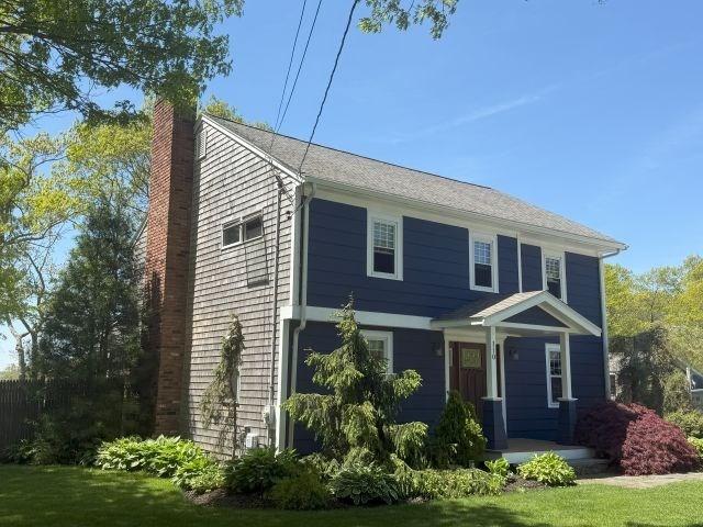 110 Atwell Cir, Marshfield, MA 02050 - view of front of house with a chimney and central AC unit