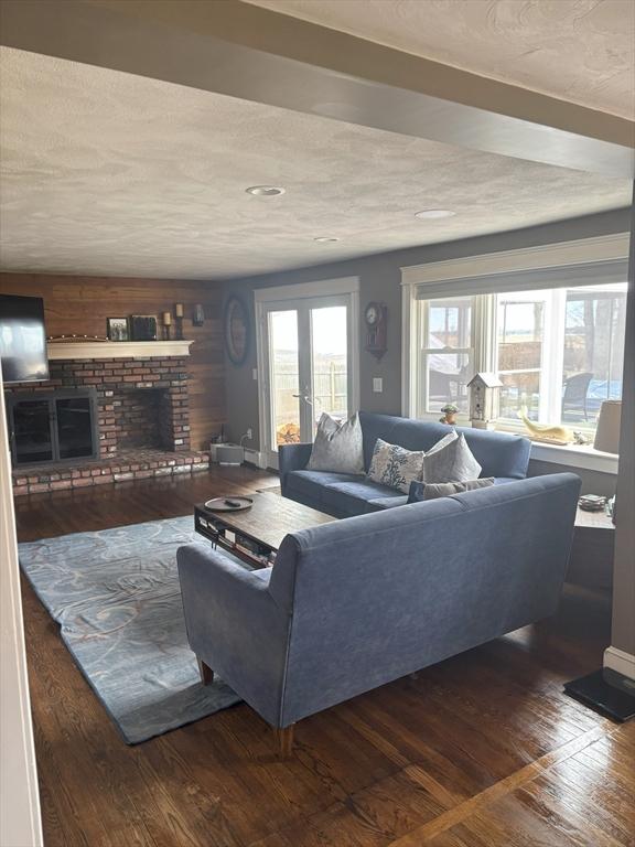 110 Atwell Cir, Marshfield, MA 02050 - living room featuring a brick fireplace and wood-type flooring