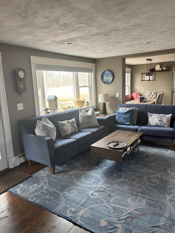 110 Atwell Cir, Marshfield, MA 02050 - living area featuring wood finished floors and a baseboard radiator