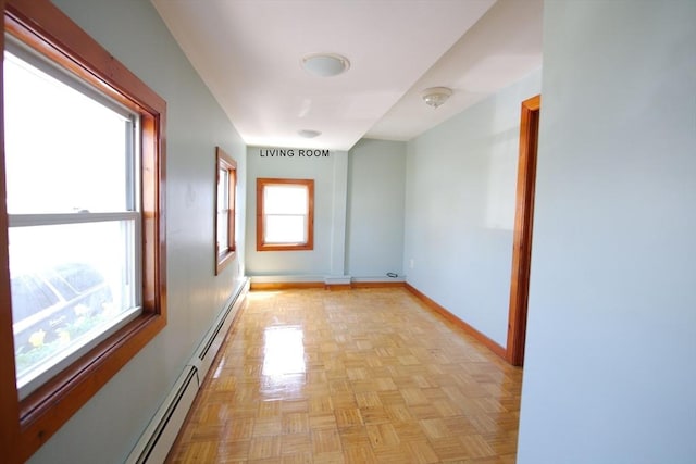 hall with baseboards and baseboard heating