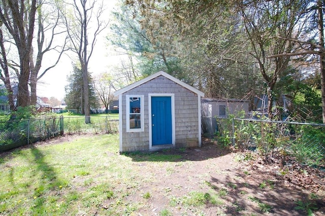 view of shed featuring a fenced backyard