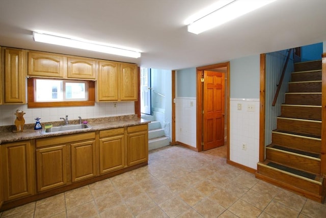 kitchen with a sink and brown cabinets