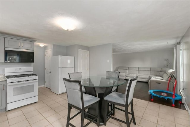 15 Crescent St Unit E, Lawrence, MA 01841 - dining space featuring light tile patterned floors