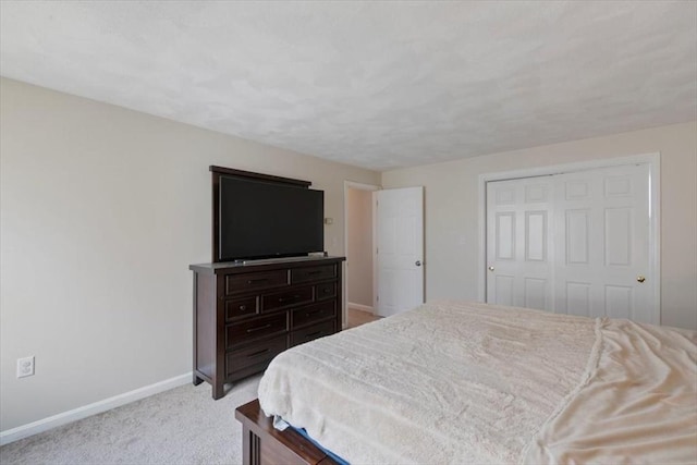 15 Crescent St Unit E, Lawrence, MA 01841 - bedroom featuring baseboards, carpet floors, and a closet