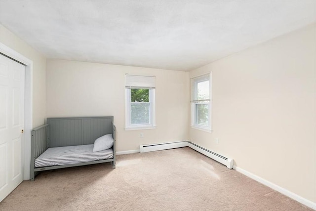 15 Crescent St Unit E, Lawrence, MA 01841 - unfurnished room featuring carpet floors, baseboards, and a baseboard radiator