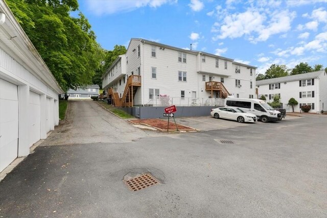 15 Crescent St Unit E, Lawrence, MA 01841 - uncovered parking lot featuring stairs