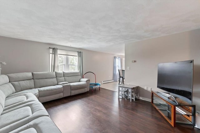 15 Crescent St Unit E, Lawrence, MA 01841 - living room featuring wood finished floors and a baseboard radiator
