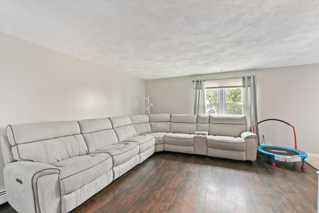 15 Crescent St Unit E, Lawrence, MA 01841 - living room with dark wood-type flooring and baseboard heating