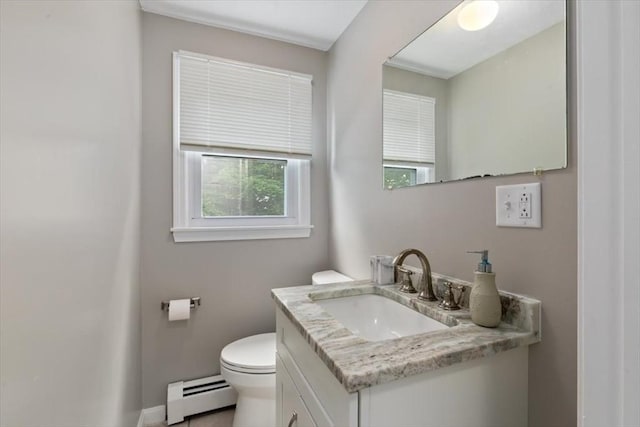 15 Crescent St Unit E, Lawrence, MA 01841 - half bathroom featuring a baseboard heating unit, vanity, toilet, and baseboards