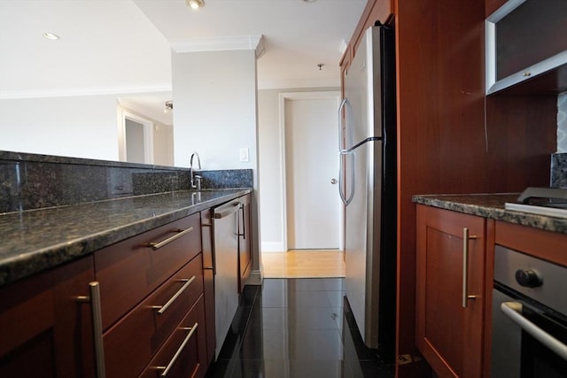 15 N Beacon St Unit 1006, Boston, MA 02134 - kitchen featuring stainless steel appliances, crown molding, baseboards, dark stone countertops, and a sink
