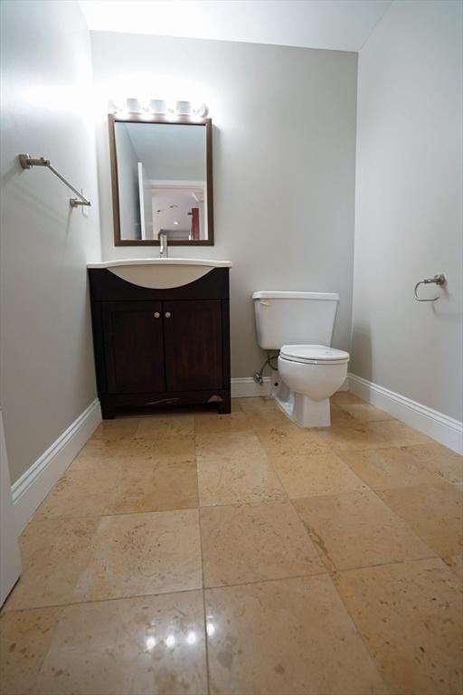 15 N Beacon St Unit 1006, Boston, MA 02134 - bathroom featuring vanity, toilet, and baseboards