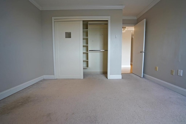 15 N Beacon St Unit 1006, Boston, MA 02134 - unfurnished bedroom with carpet, ornamental molding, baseboards, and a closet