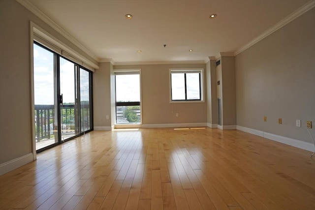 15 N Beacon St Unit 1006, Boston, MA 02134 - empty room with plenty of natural light, ornamental molding, light wood-style flooring, and baseboards