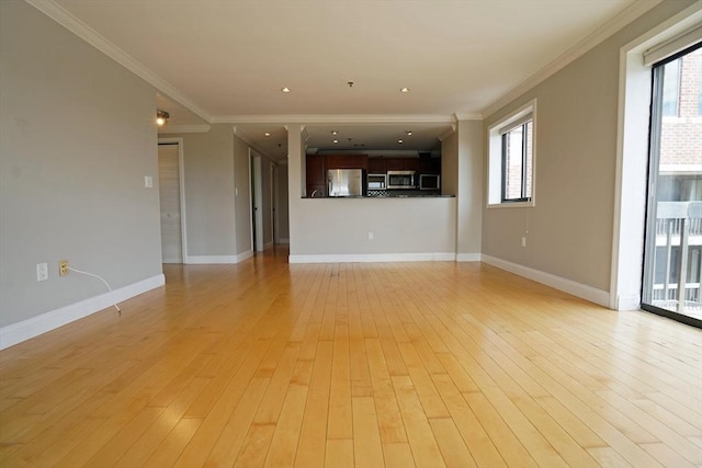 15 N Beacon St Unit 1006, Boston, MA 02134 - unfurnished living room featuring ornamental molding, healthy amount of natural light, light wood-type flooring, and baseboards
