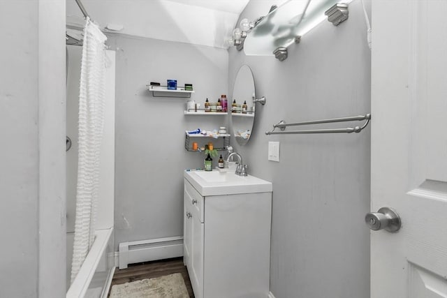 631 Chestnut St, Athol, MA 01331 - full bath featuring a baseboard radiator, vanity, and wood finished floors
