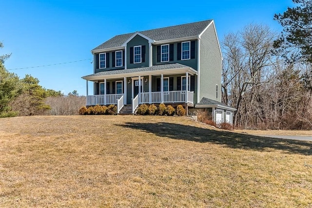 colonial home featuring covered porch and a front yard