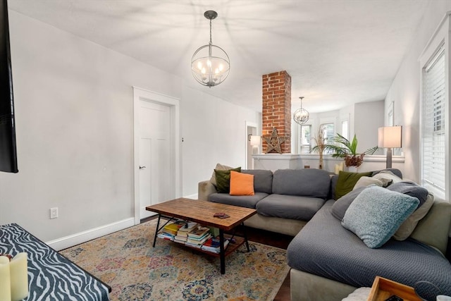 120 Fulton St, Lowell, MA 01850 - living area featuring a chandelier and baseboards