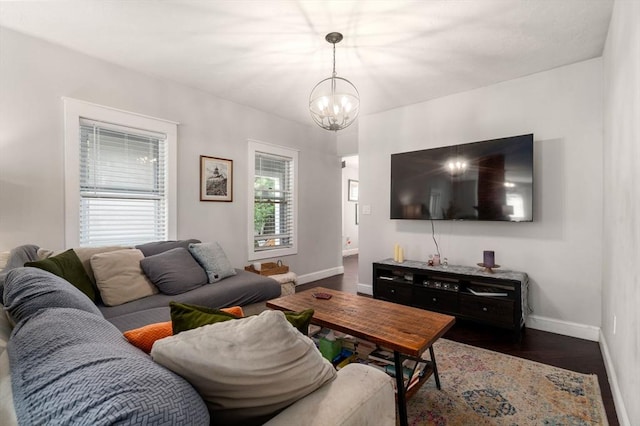 120 Fulton St, Lowell, MA 01850 - living area with baseboards, a chandelier, and dark wood-style flooring