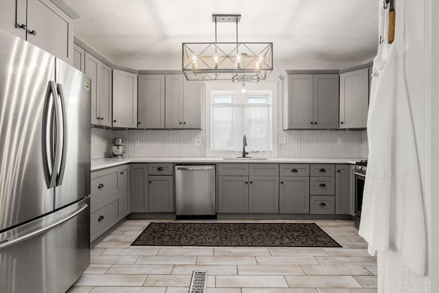 120 Fulton St, Lowell, MA 01850 - kitchen with appliances with stainless steel finishes, gray cabinets, and a sink