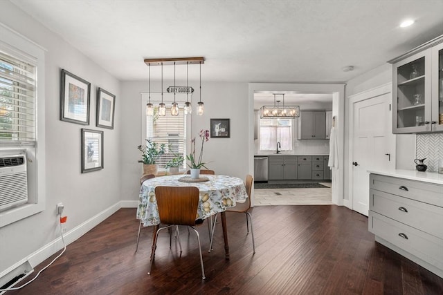 120 Fulton St, Lowell, MA 01850 - dining room with baseboards, dark wood finished floors, and a chandelier