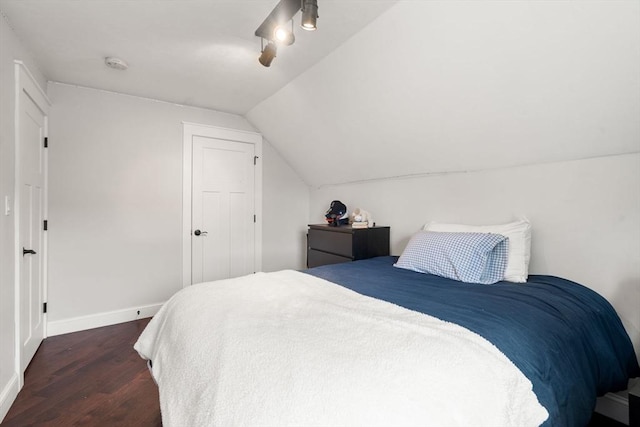 120 Fulton St, Lowell, MA 01850 - bedroom featuring dark wood-type flooring, vaulted ceiling, baseboards, and ceiling fan